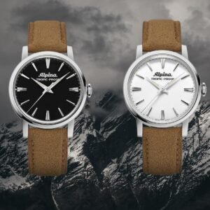 Alpina Heritage Tropic-Proof: le due varianti con quadrante bianco e nero fotografate frontalmente su sfondo alpino. Orologi da 34mm con cassa in acciaio, lancette dauphine e cinturino in Alcantara beige, fedeli riedizioni del modello storico del 1965. L'essenza dell'orologeria sportiva svizzera con DNA Alpina.