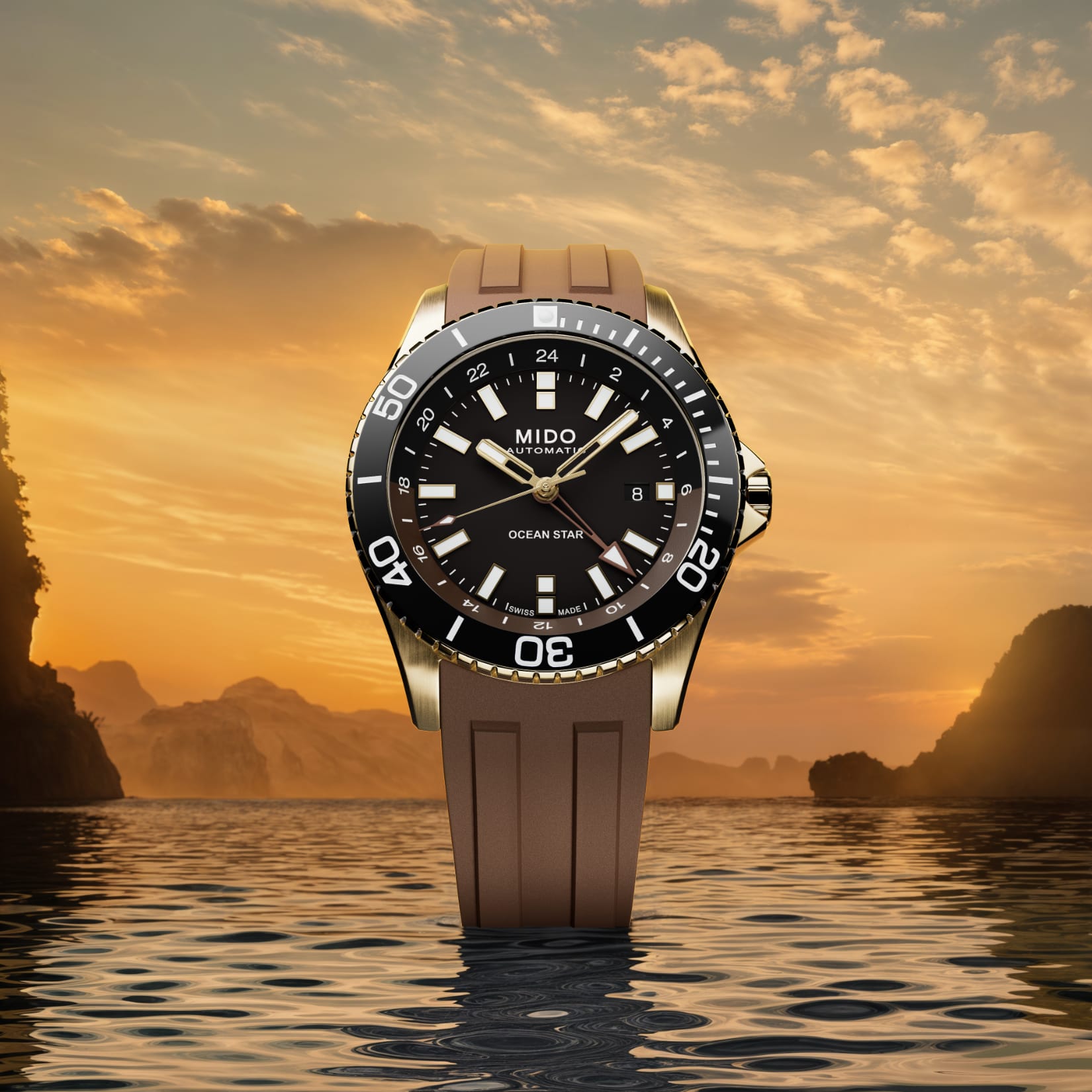 Mido Ocean Star GMT M026.629.37.291.00 in PVD oro giallo con quadrante nero e cinturino cioccolato.