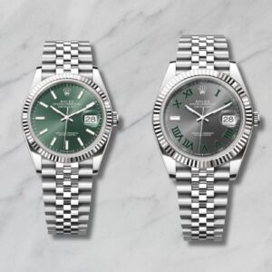 Confronto visivo Rolex Datejust 36mm e 41mm affiancati su sfondo marmoreo, evidenziando le differenze dimensionali tra i due modelli