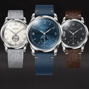 Lebois & Co Heritage Small Seconds collezione completa con tre modelli Script, Numeral e Baton con quadranti crema, blu e nero su sfondo scuro.