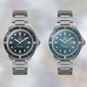 Orologi Yema Navygraf con quadrante madreperla nero e blu su sfondo perlato sfumato.