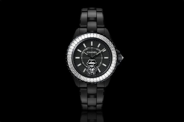 Chanel J12 Coco Game – Ceramica Nera, Watches and Wonders 2026 Chanel J12 Coco Game 2026 versione nera: ceramica nera opaca con lunetta baguette e personaggio pixelato di Gabrielle Chanel sulla lancetta dei secondi.