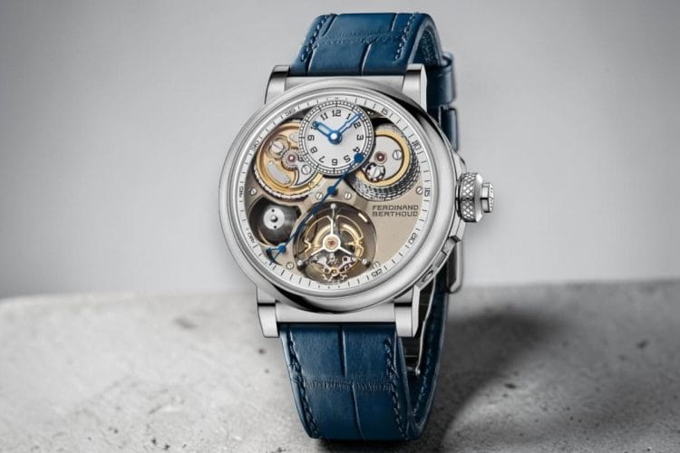 Ferdinand Berthoud Chronomètre FB 2TV.1 – Watches and Wonders 2026 Ferdinand Berthoud Chronomètre FB 2TV.1 2026: quadrante aperto con tourbillon volante a ore 6, trasmissione a catena e fusée visibile, display delle ore su sottoquadrante a ore 12 in oro bianco con cinturino in pelle blu, presentato a Watches and Wonders 2026.